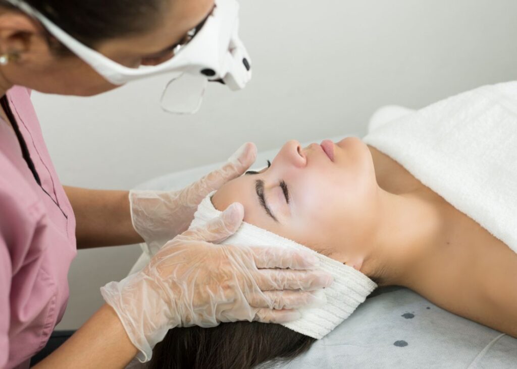 A patient receiving IPL preparation treatment for rosacea and skin improvement.
