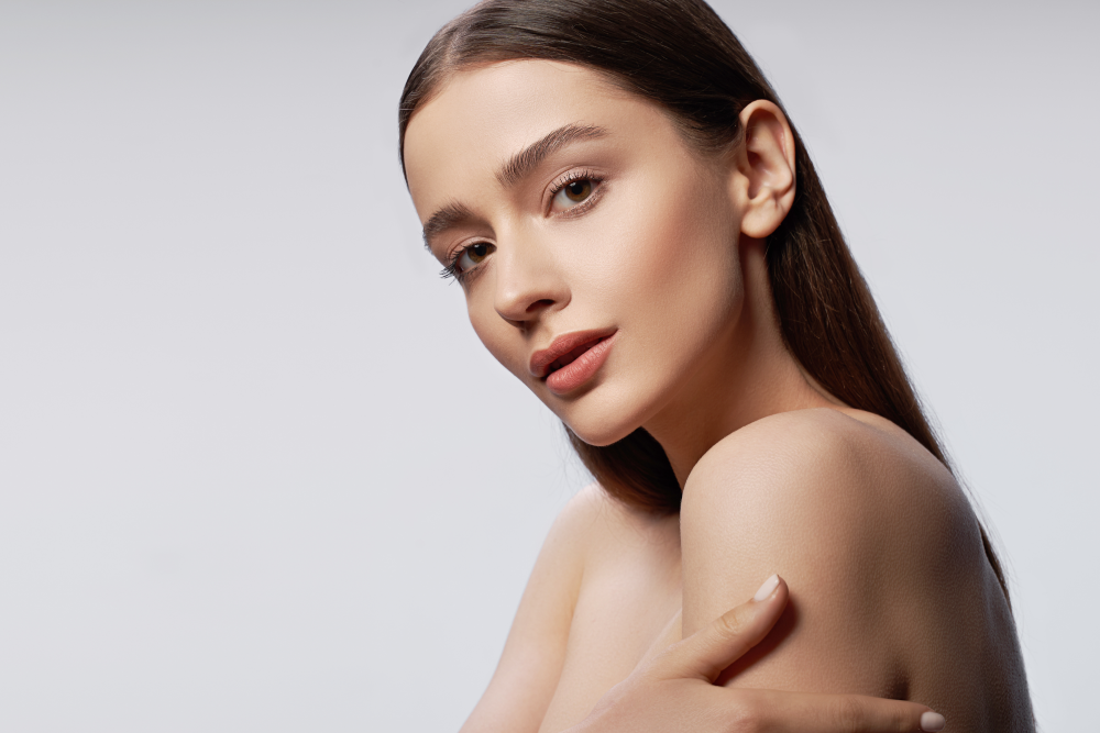 Woman with flawless skin after microneedling treatment.