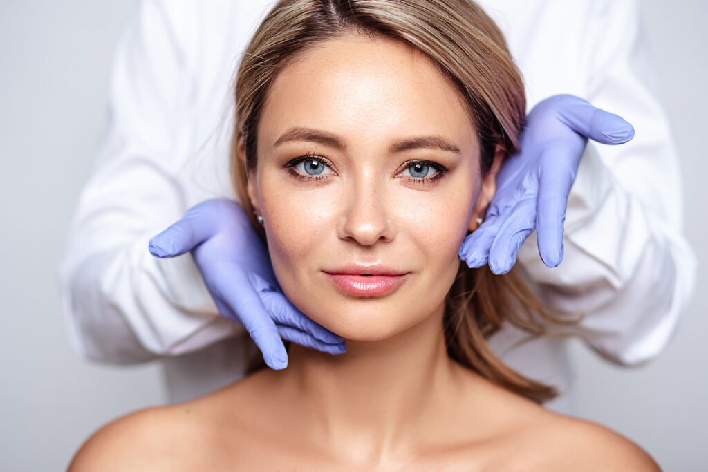 Woman with glowing skin after microneedling treatment.